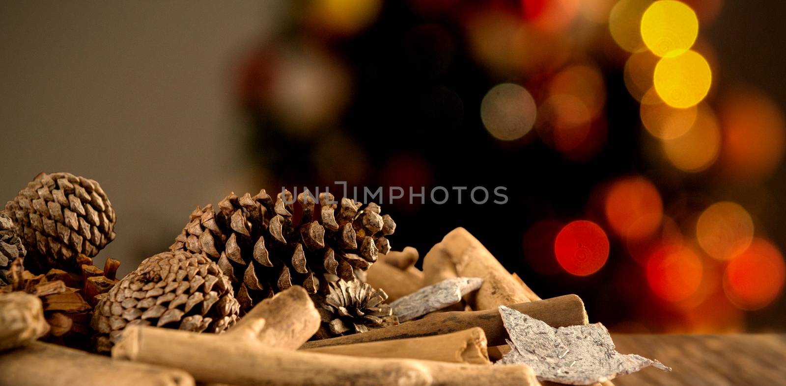 Composite image of christmas decorations on wooden table by Wavebreakmedia