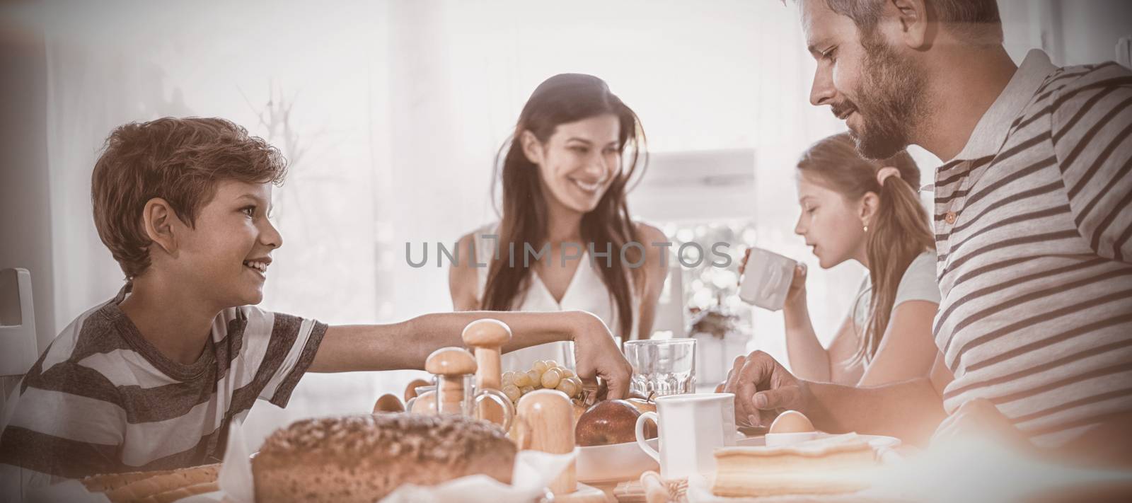Happy family having breakfast by Wavebreakmedia