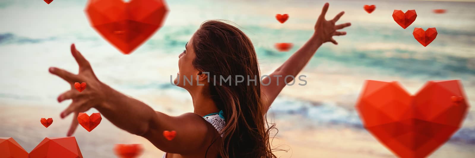 Red heart with white blackground against side view of woman stretching out her arms