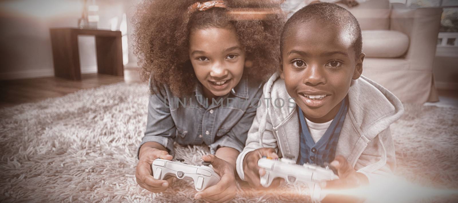Portrait of children playing video games at home