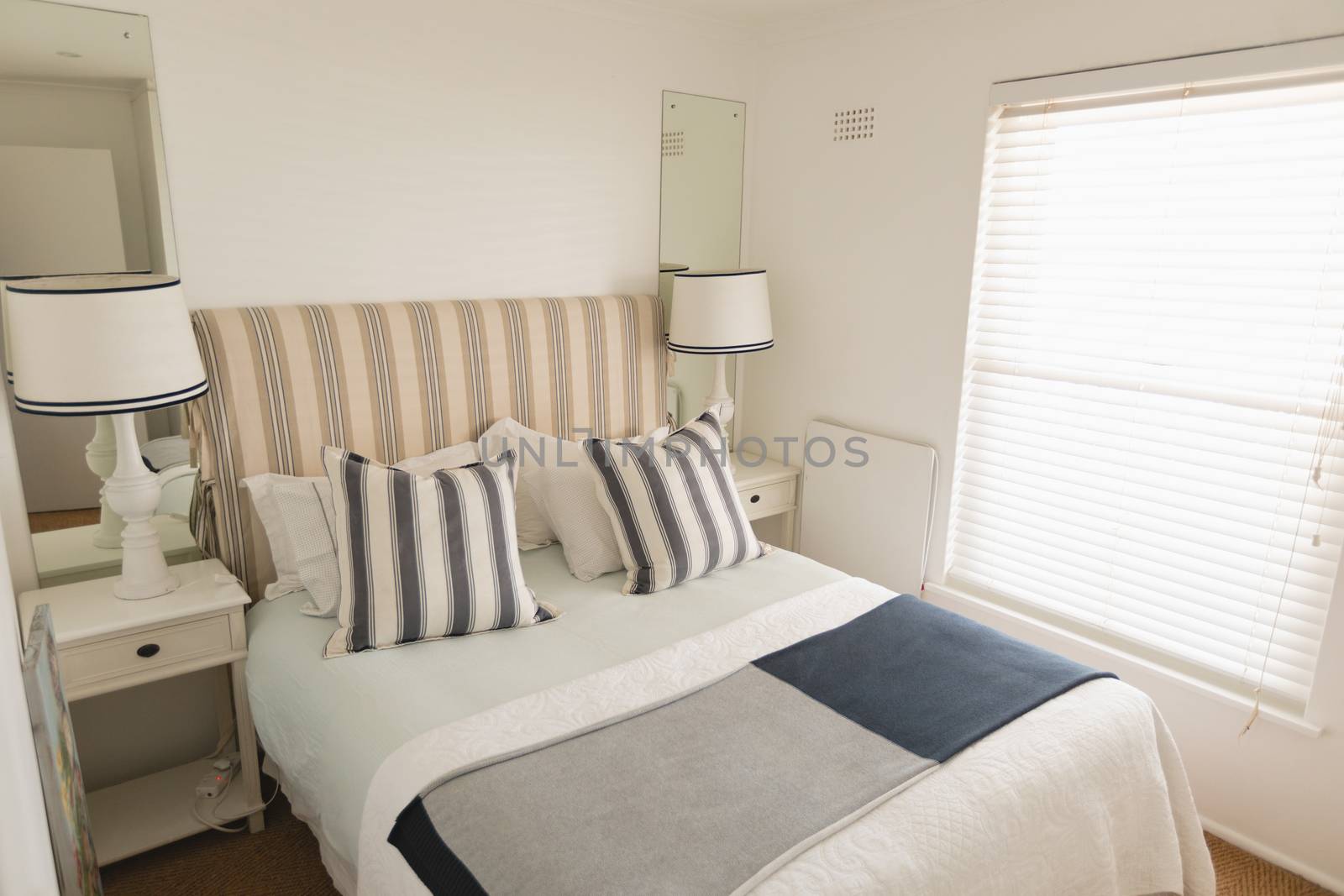 Modern luxury bedroom with double bed blankets and pillows at home
