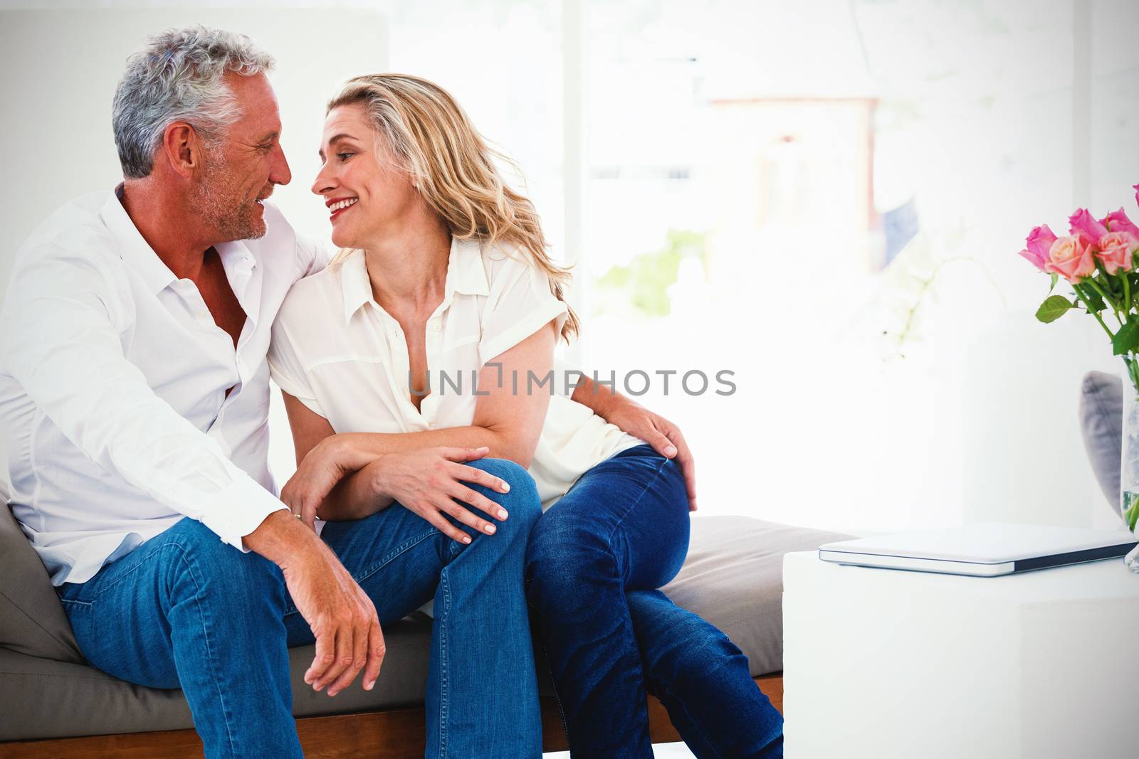 Romantic mature couple sitting face to face  by Wavebreakmedia