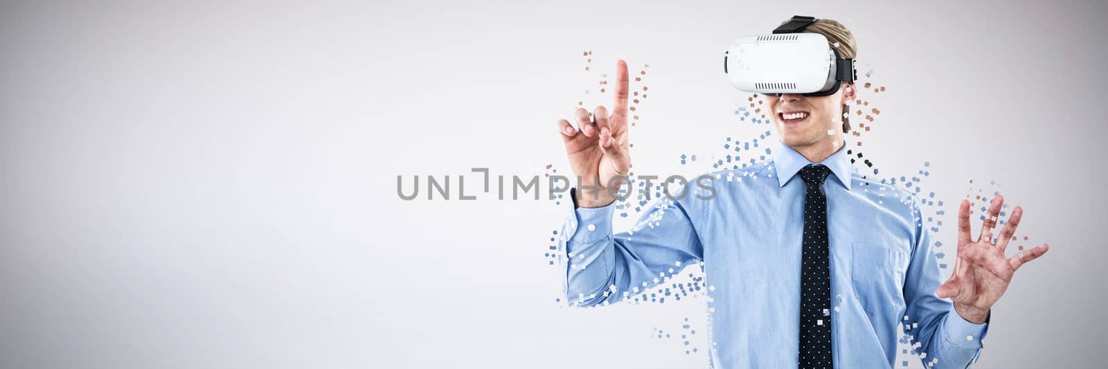Composite image of happy young businessman gesturing while wearing futuristic glasses by Wavebreakmedia