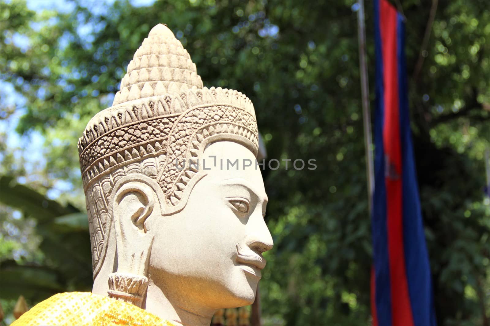 Stone buddha statue guarding a temple in asia