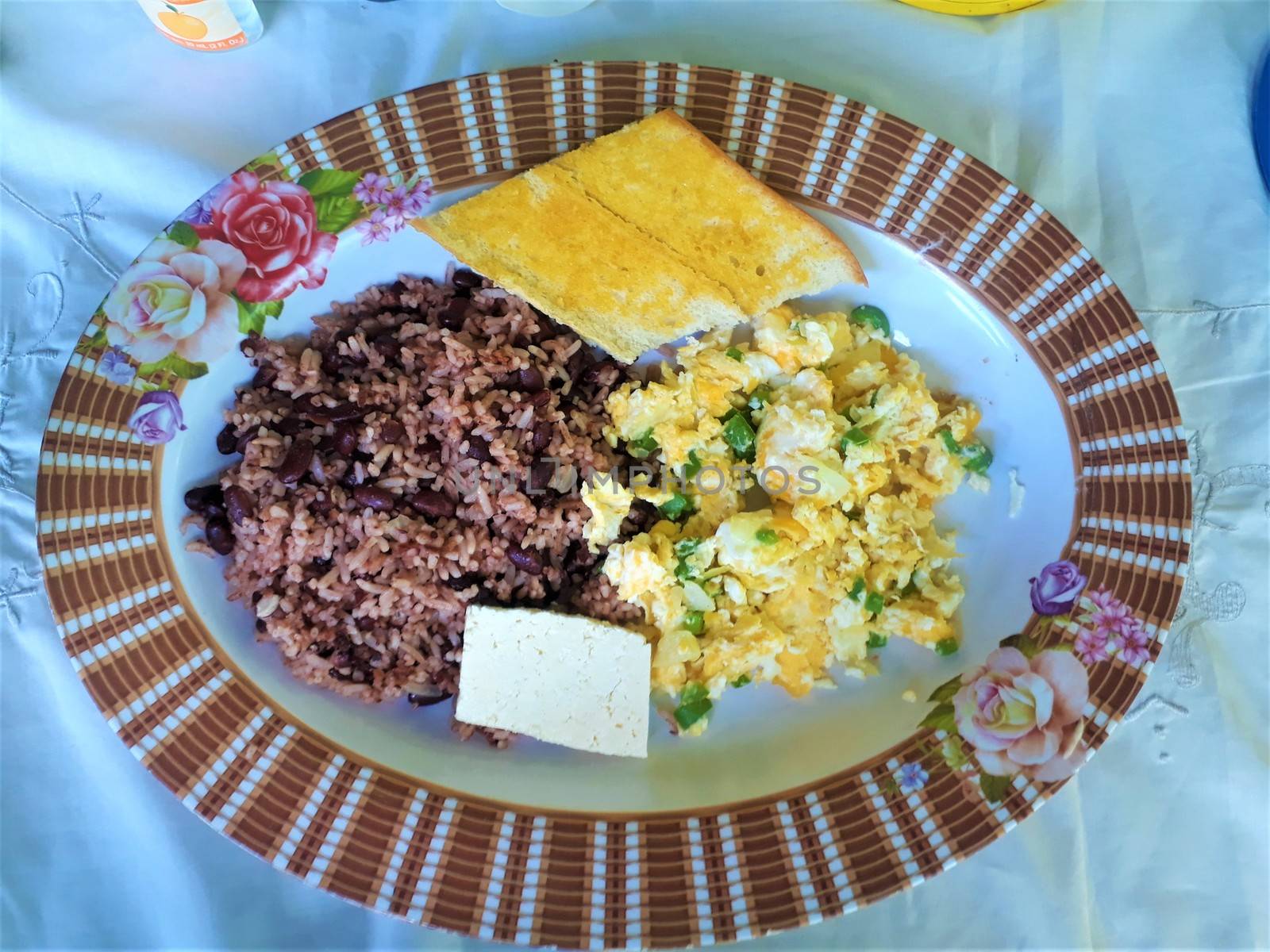 Nicaraguan breakfast. Rice, beans, eggs, bread, cheese