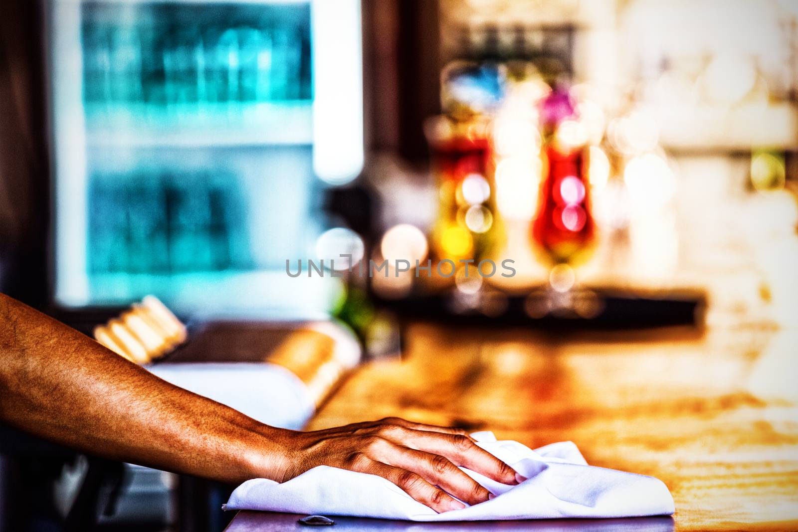 Waitress cleaning the counter in a restaurant, Close-up