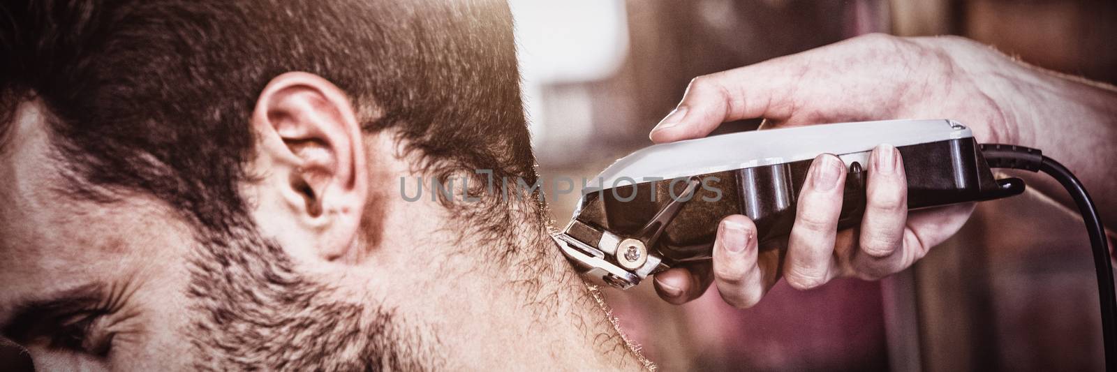 Man getting his hair trimmed at the hair salon