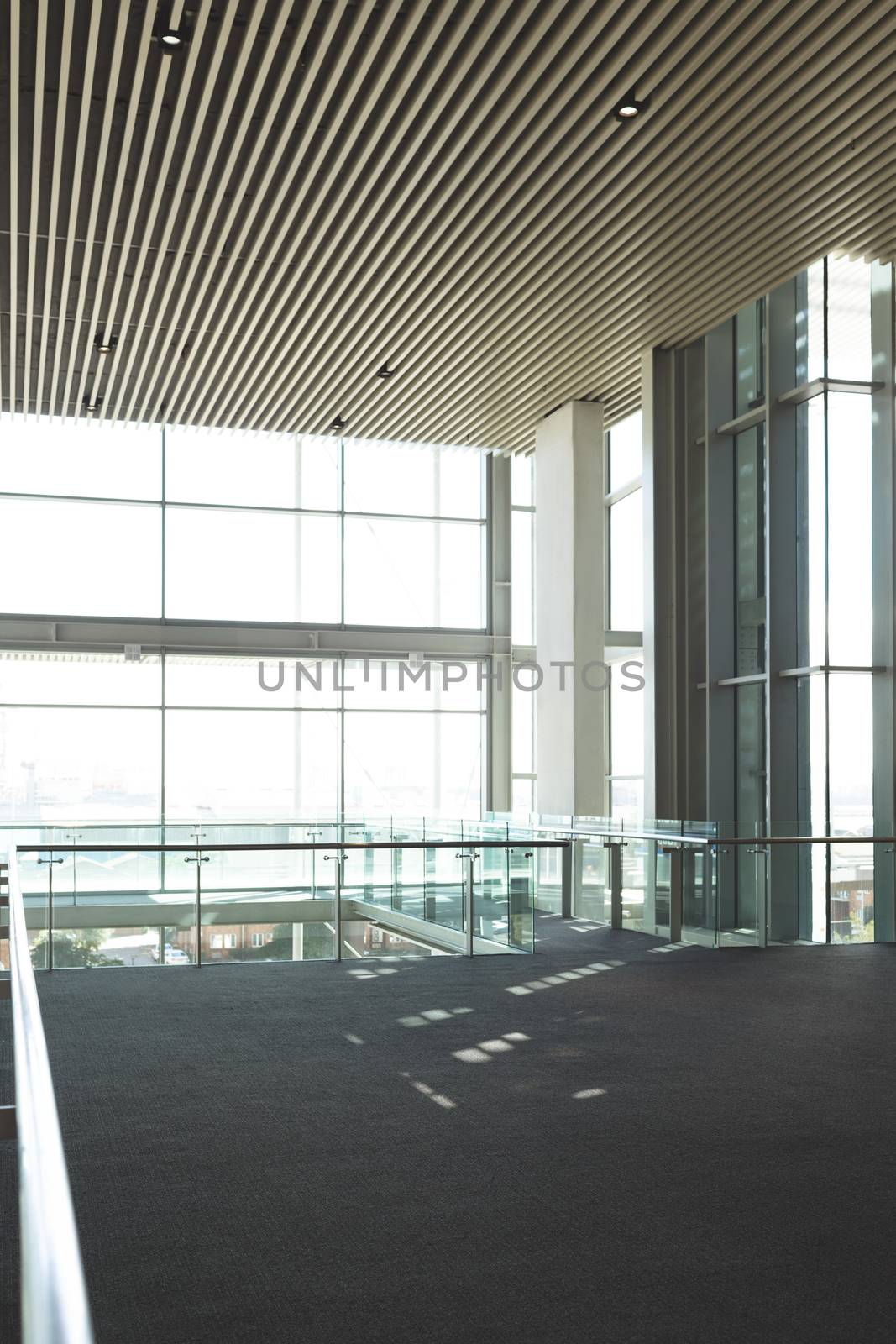 Empty commercial modern business office balcony with big windows showing view