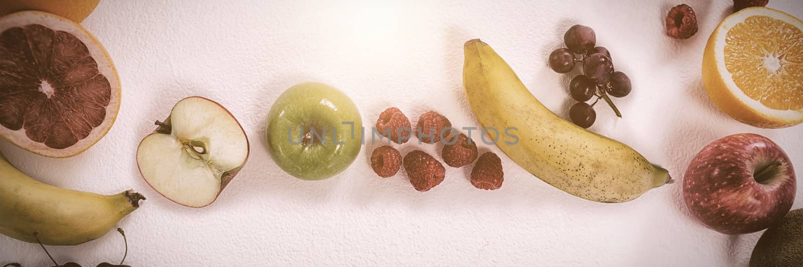 Various types of fruits arranged on white background by Wavebreakmedia