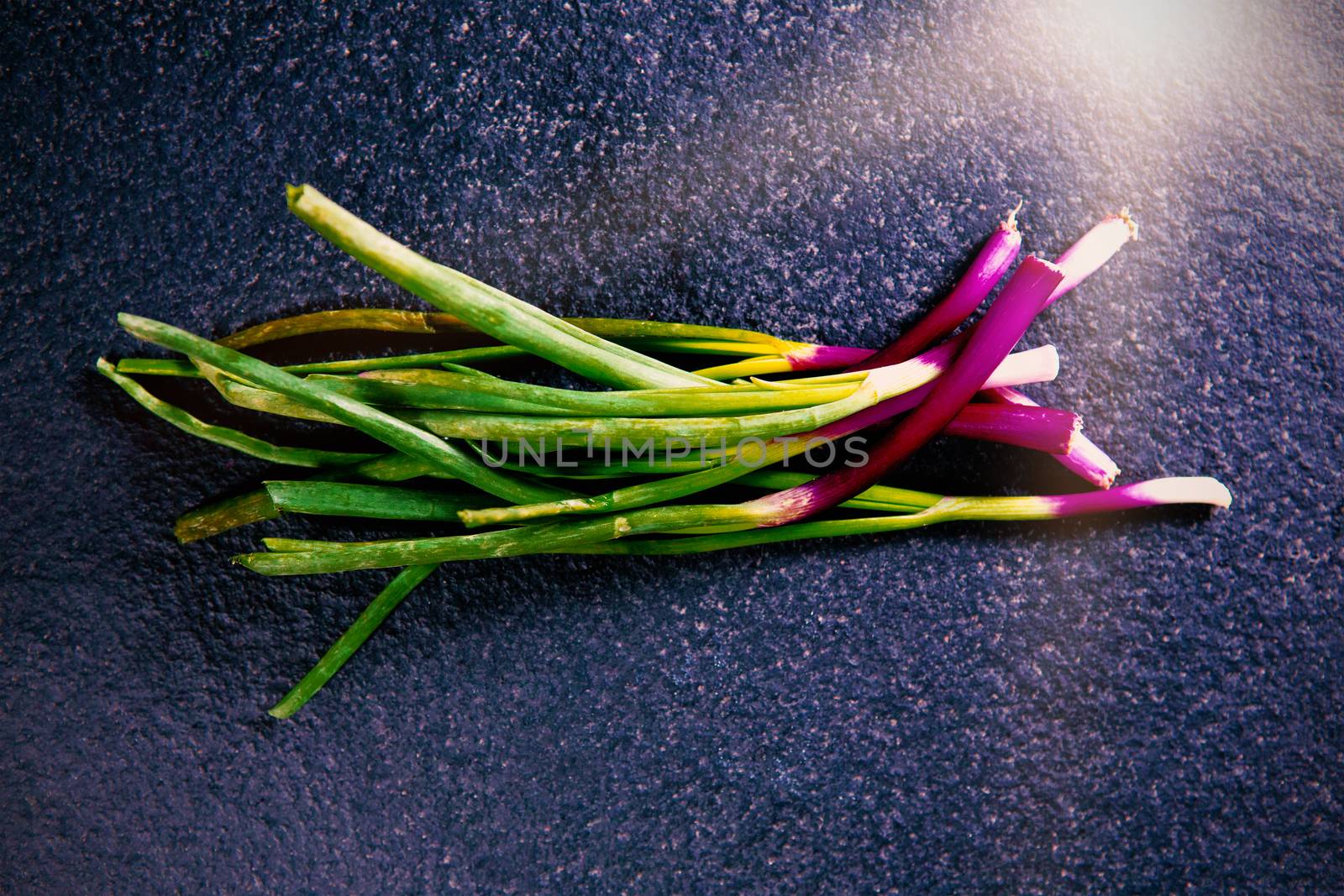 High angle view of green vegetables on gray slate