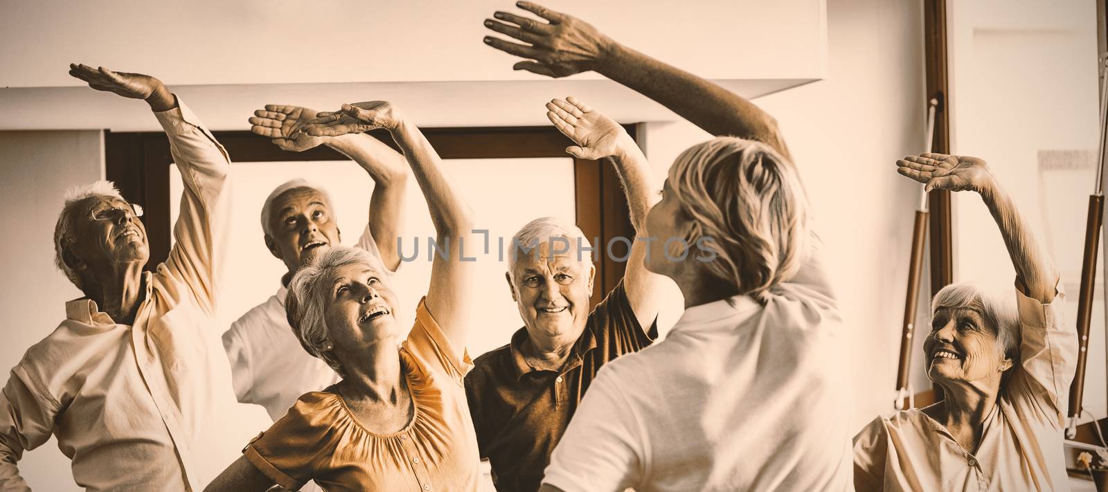 Seniors doing exercises in a retirement home