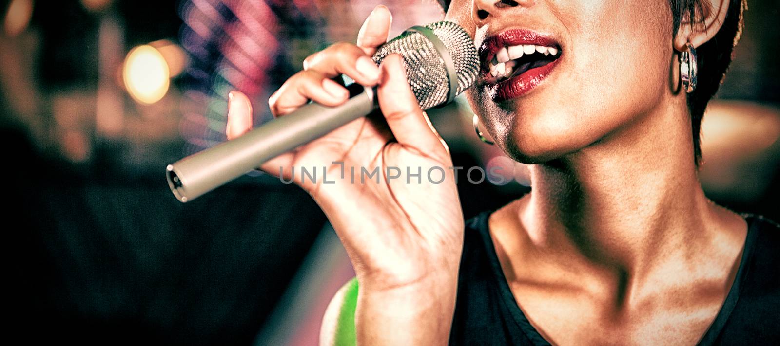 Beautiful woman singing in bar