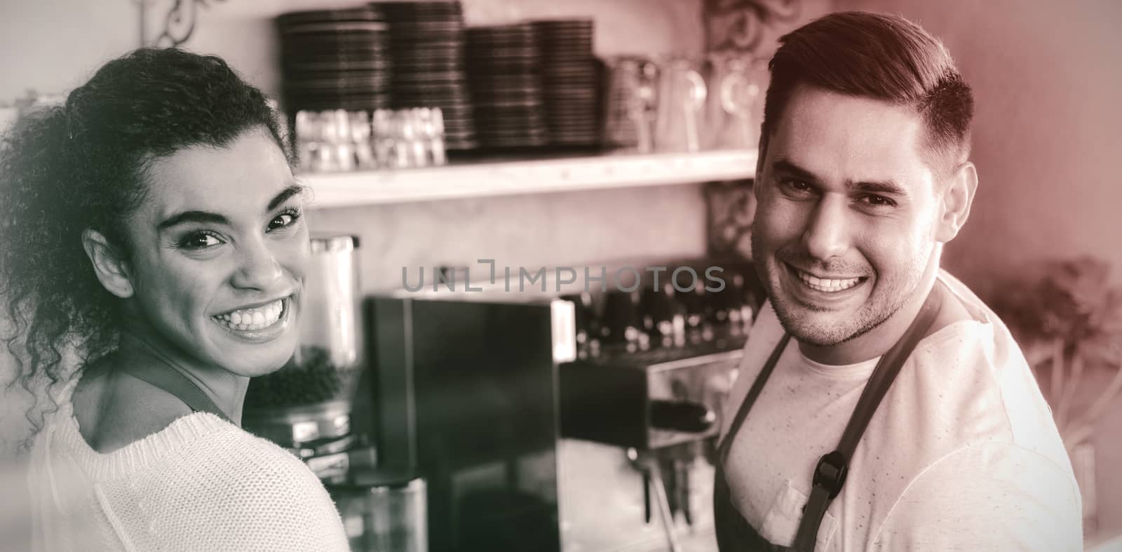 Portrait of smiling waitress and waiter in cafe