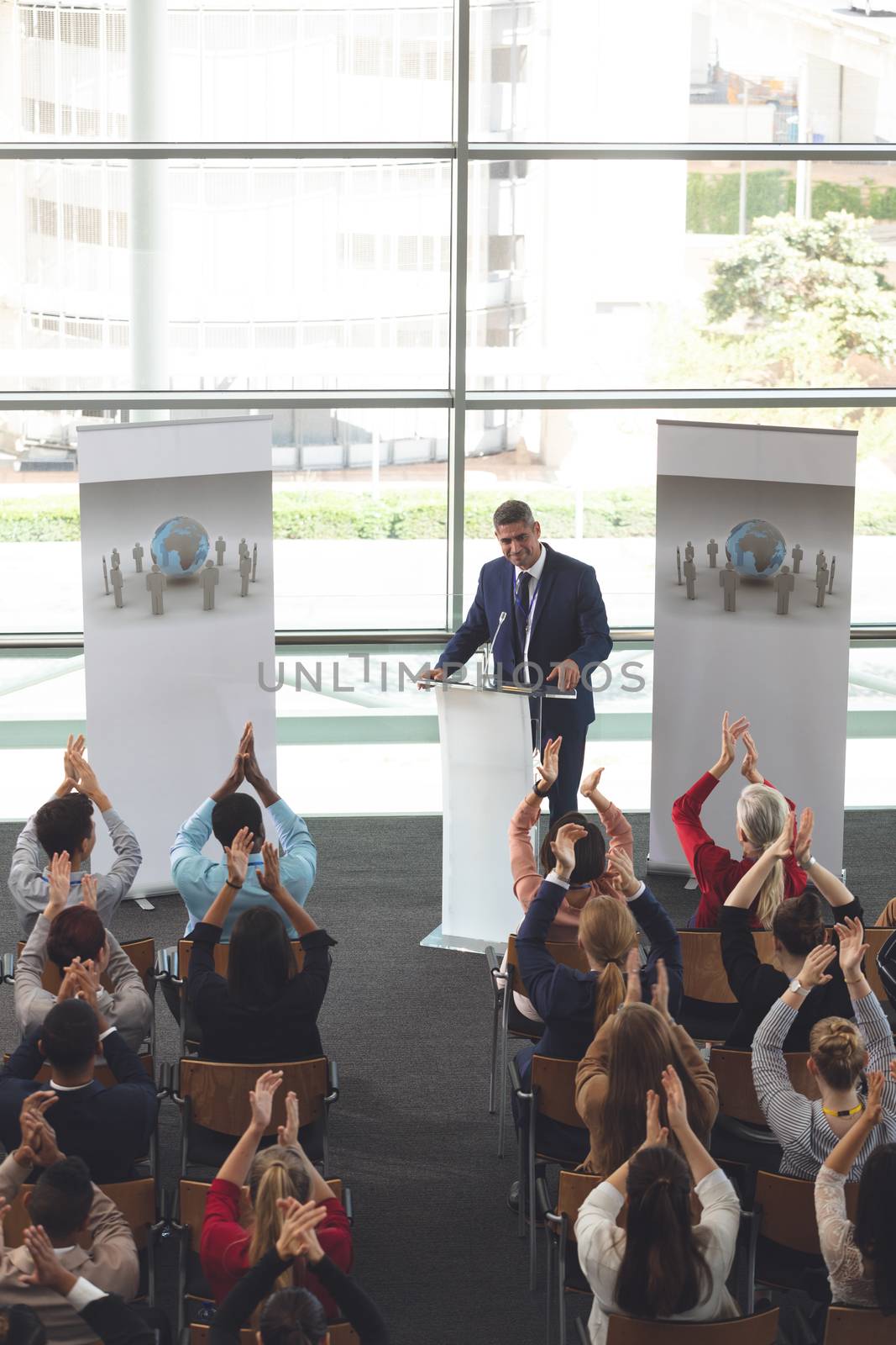 Business people applauding in a business seminar by Wavebreakmedia