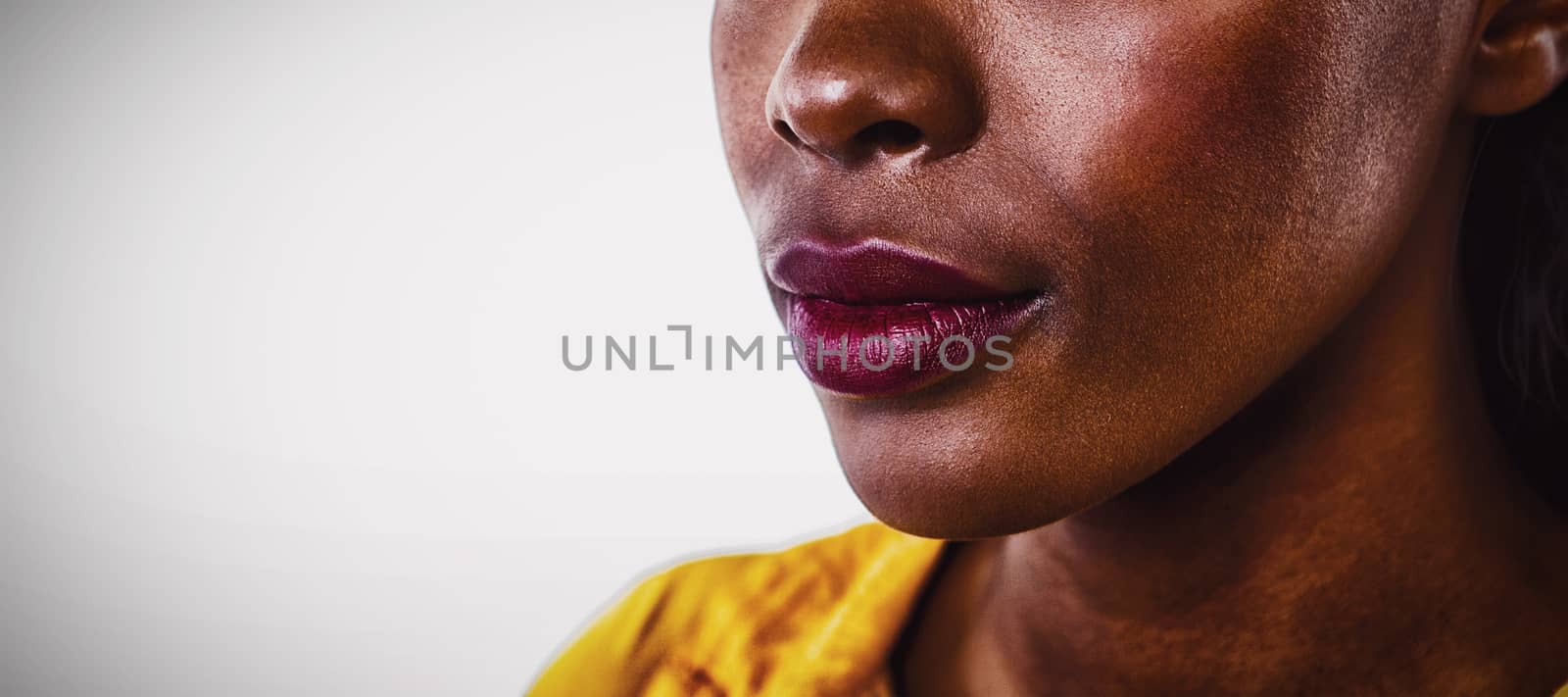 Close up of contemplated young woman against  white background