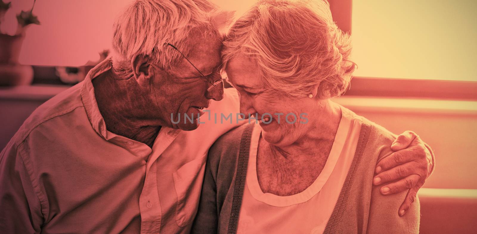 Senior couple hugging each other in a retirement home