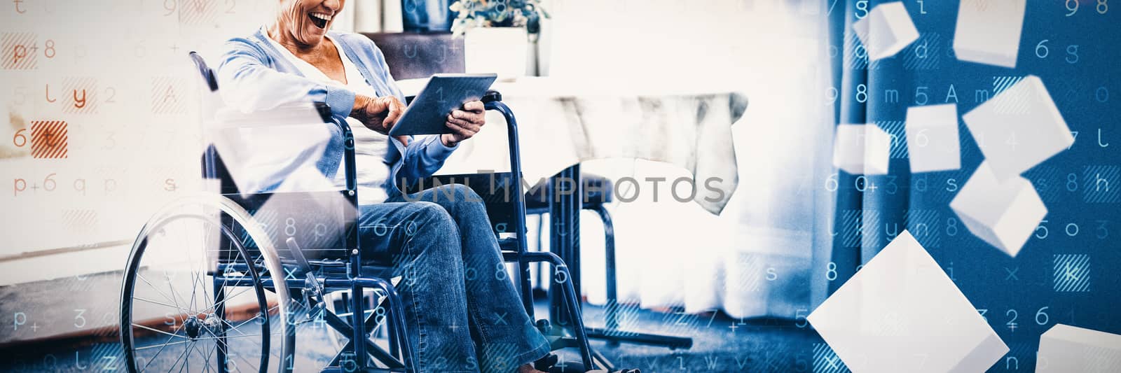 Excited senior woman on wheelchair using digital tablet by Wavebreakmedia