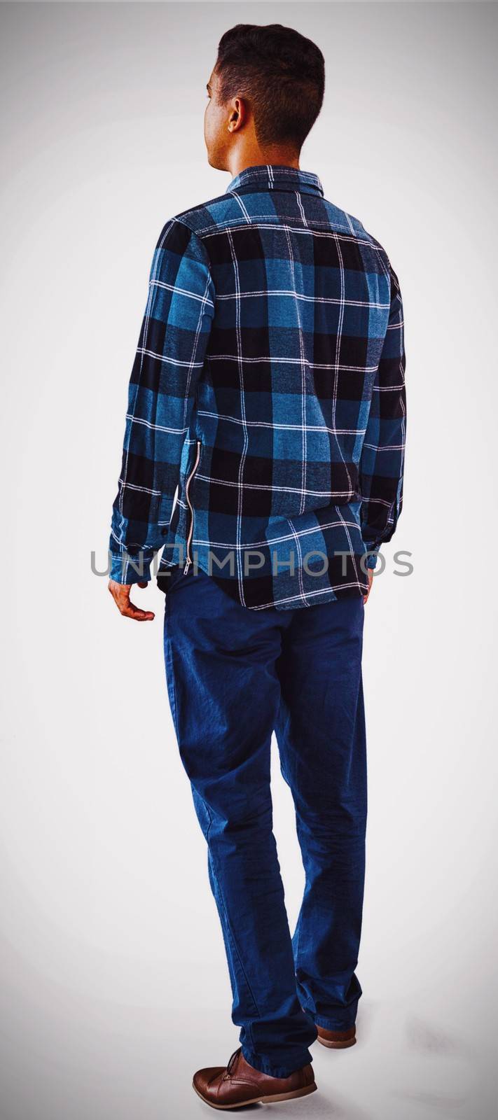 Full length of man looking away against white background