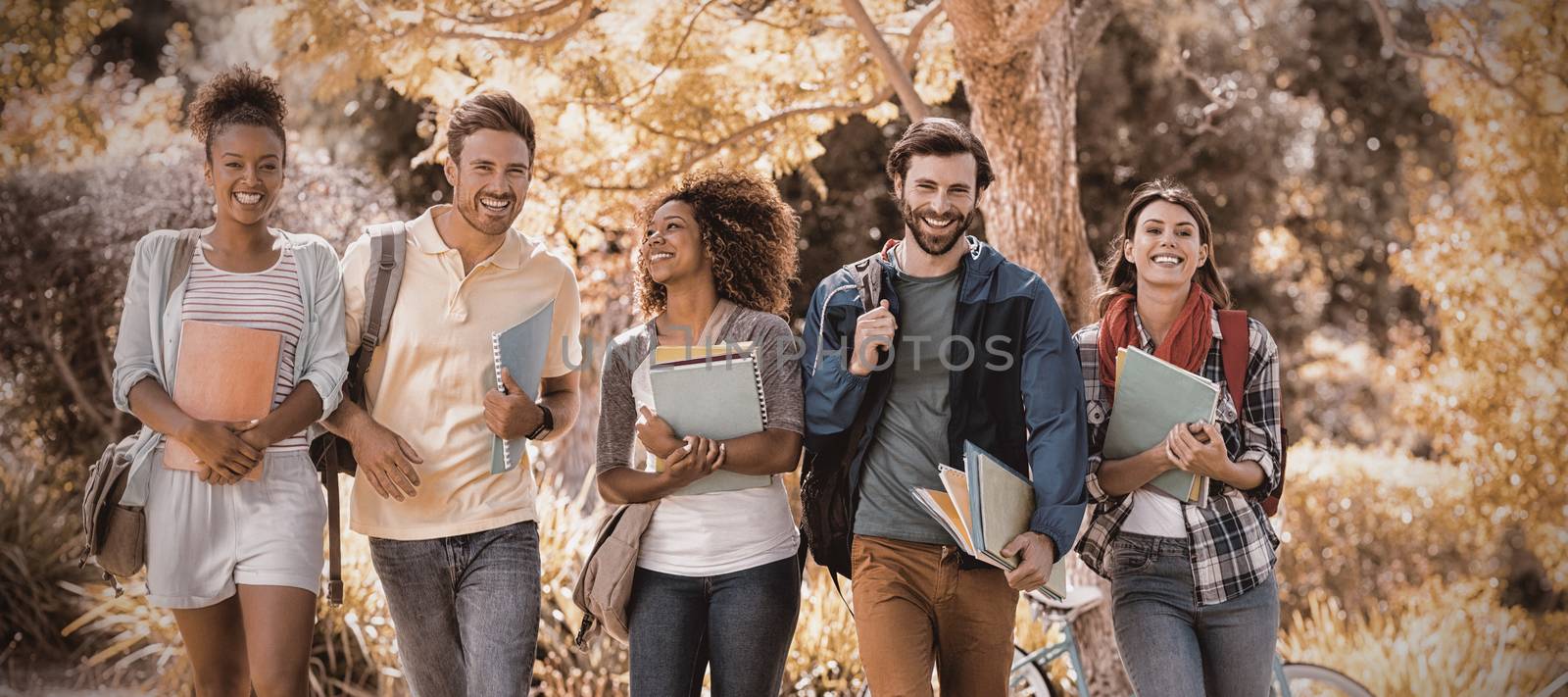 Group of college friends walking in campus