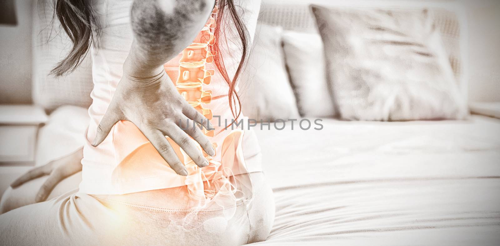 Digital composite of highlighted spine of woman with back pain at home