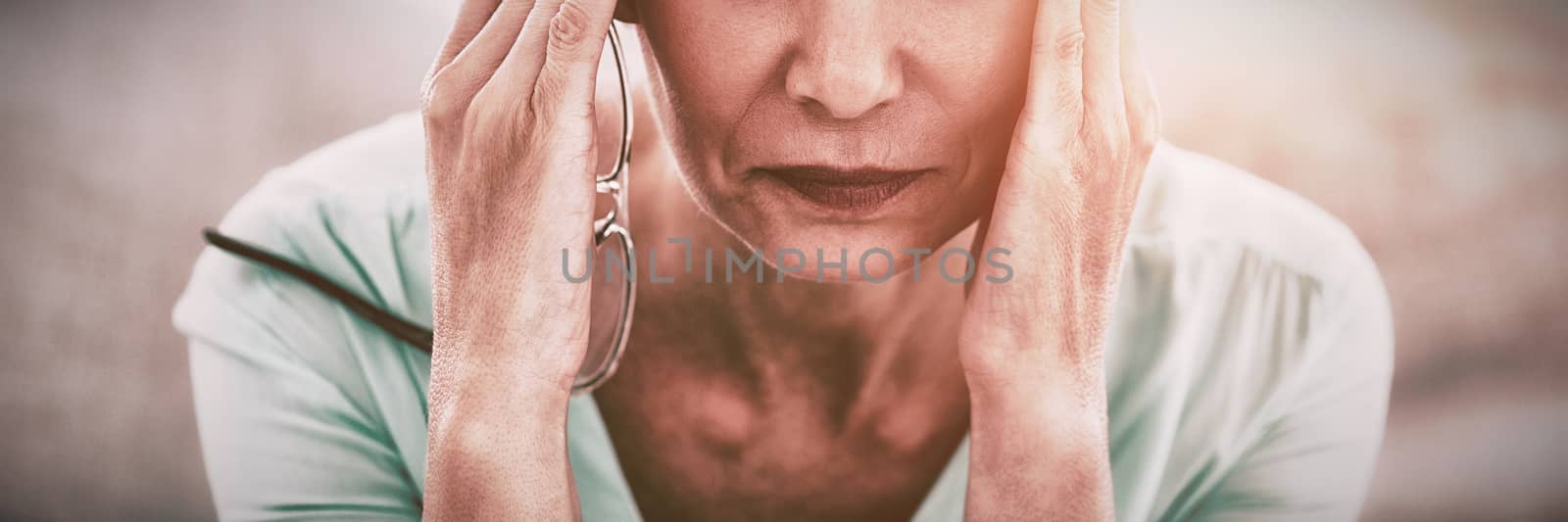 Portrait of woman suffering headache by Wavebreakmedia