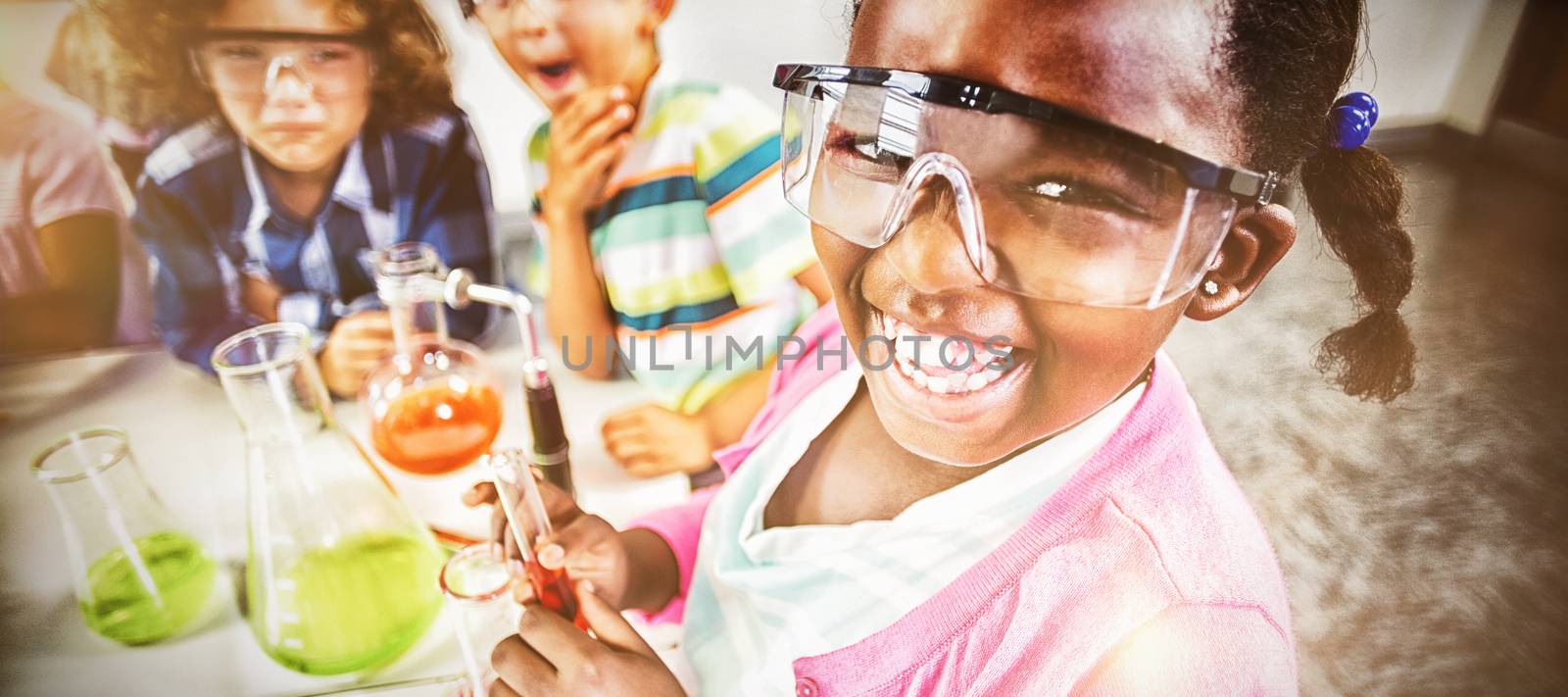 Kids doing a chemical experiment in laboratory by Wavebreakmedia