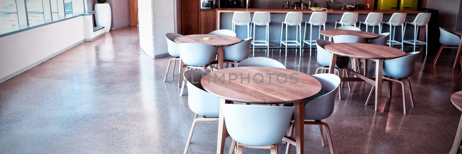 Empty chair and table in cafeteria at office