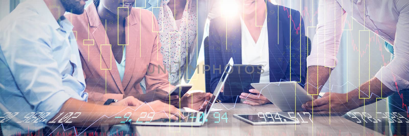 Stocks and shares against business people interacting using laptop, mobile phone and digital tablet