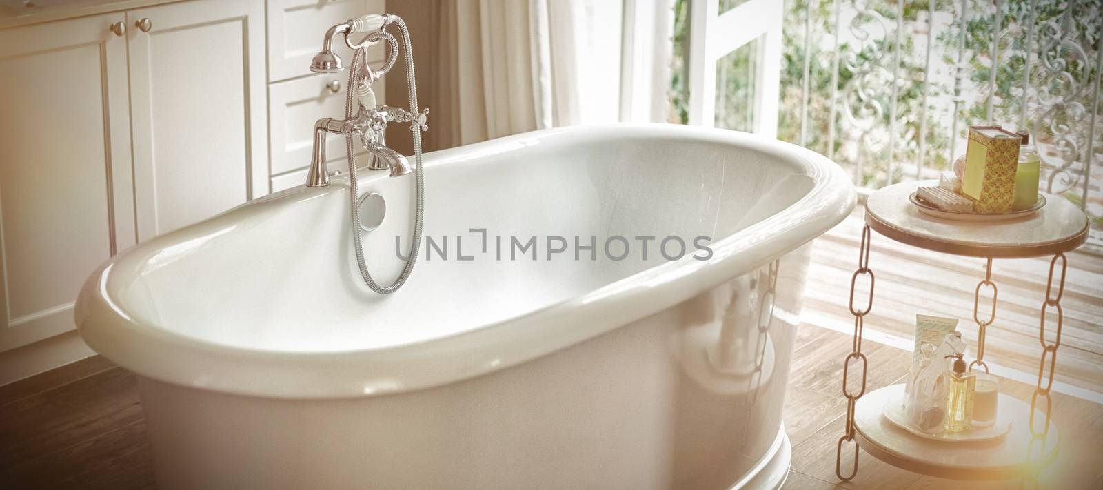 View of empty bathtub in bathroom at home