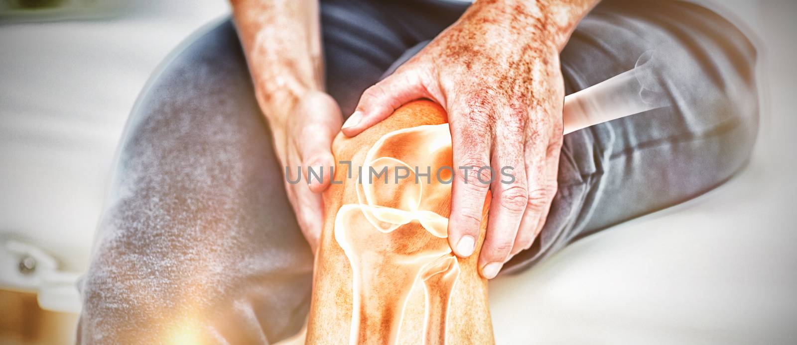 Digitally composite image of man suffering with knee cramp 