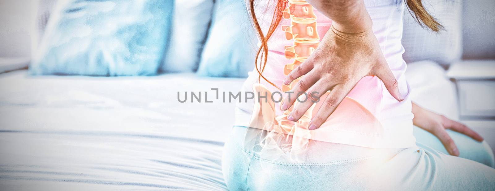 Digital composite of highlighted spine of woman with back pain by Wavebreakmedia