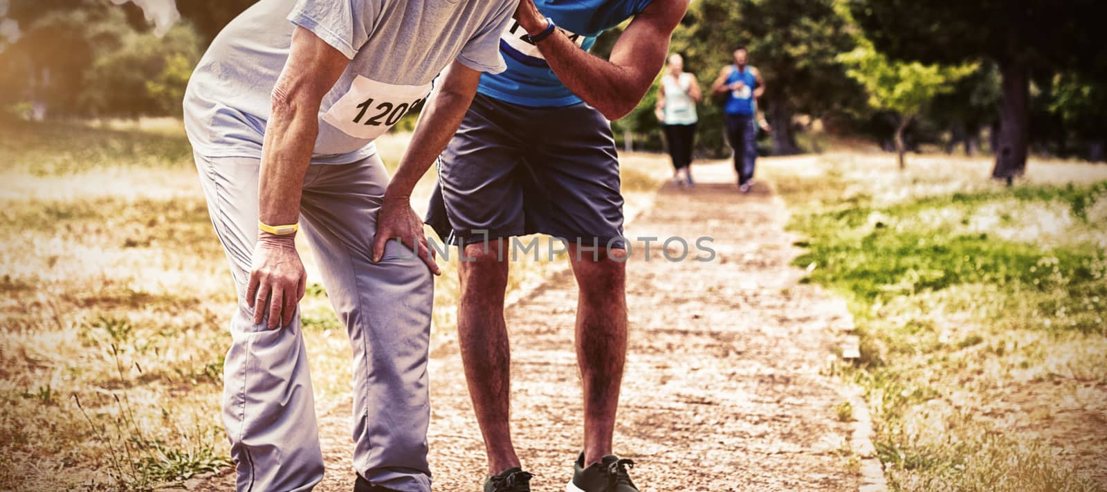 Exhausted senior man in park after race