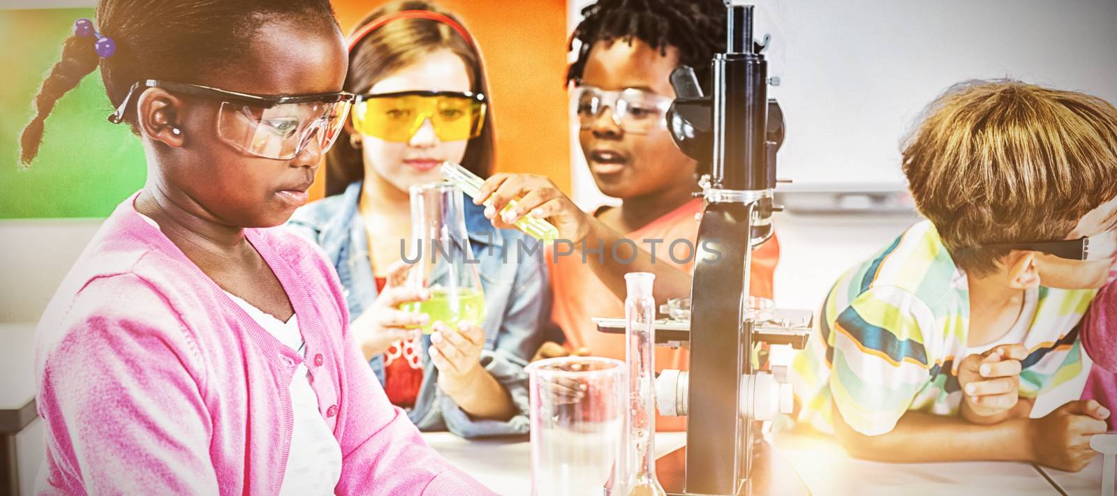 Kids doing a chemical experiment in laboratory by Wavebreakmedia