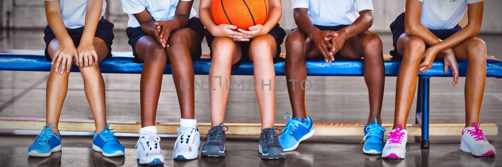 Children enjoying at basketball court in school