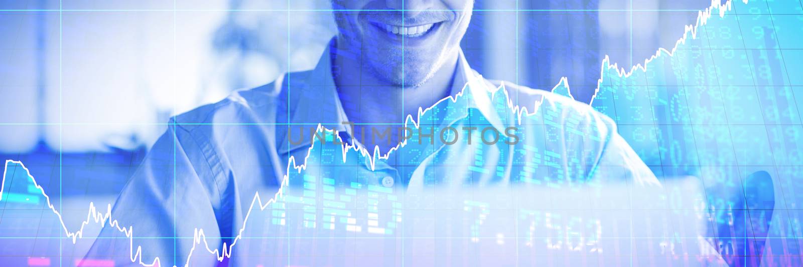 Stocks and shares against smiling man using laptop