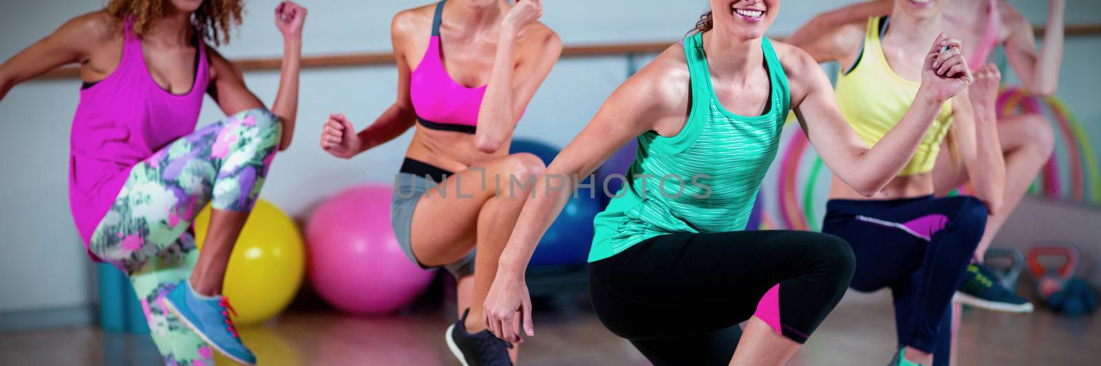 Group of women performing aerobics by Wavebreakmedia