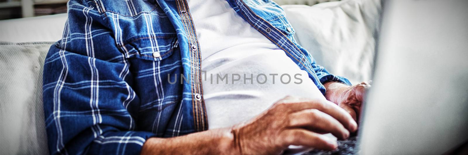 Portrait of senior man using laptop by Wavebreakmedia