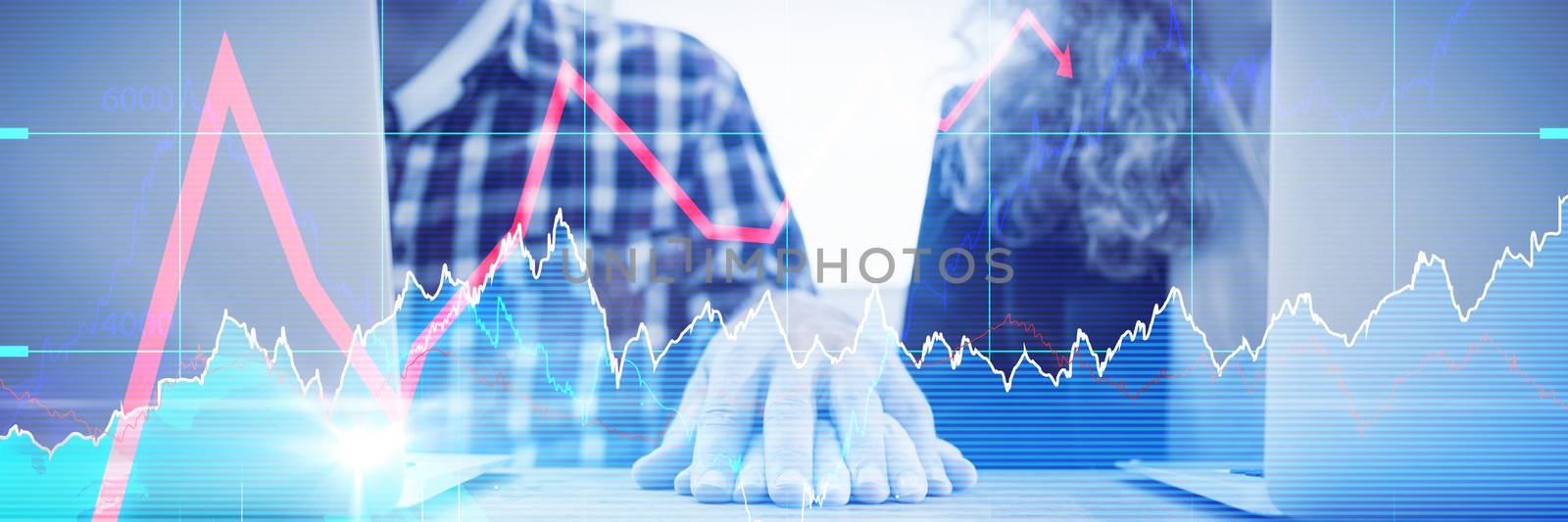 Stocks and shares against colleagues holding hands