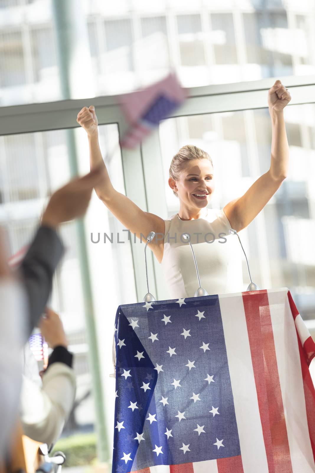 Young Caucasian businesswoman doing speech to business people in conference room during meeting by Wavebreakmedia