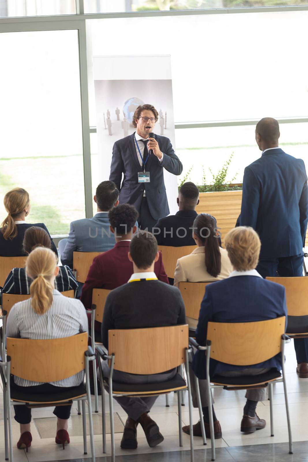 Caucasian businessman doing a speech in conference room by Wavebreakmedia