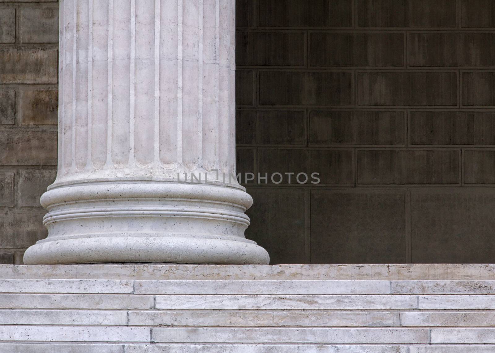 White stone columns with pedestal stairs.