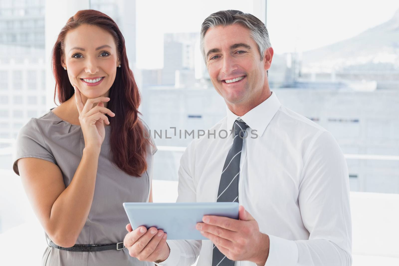 Business people smiling at camera by Wavebreakmedia