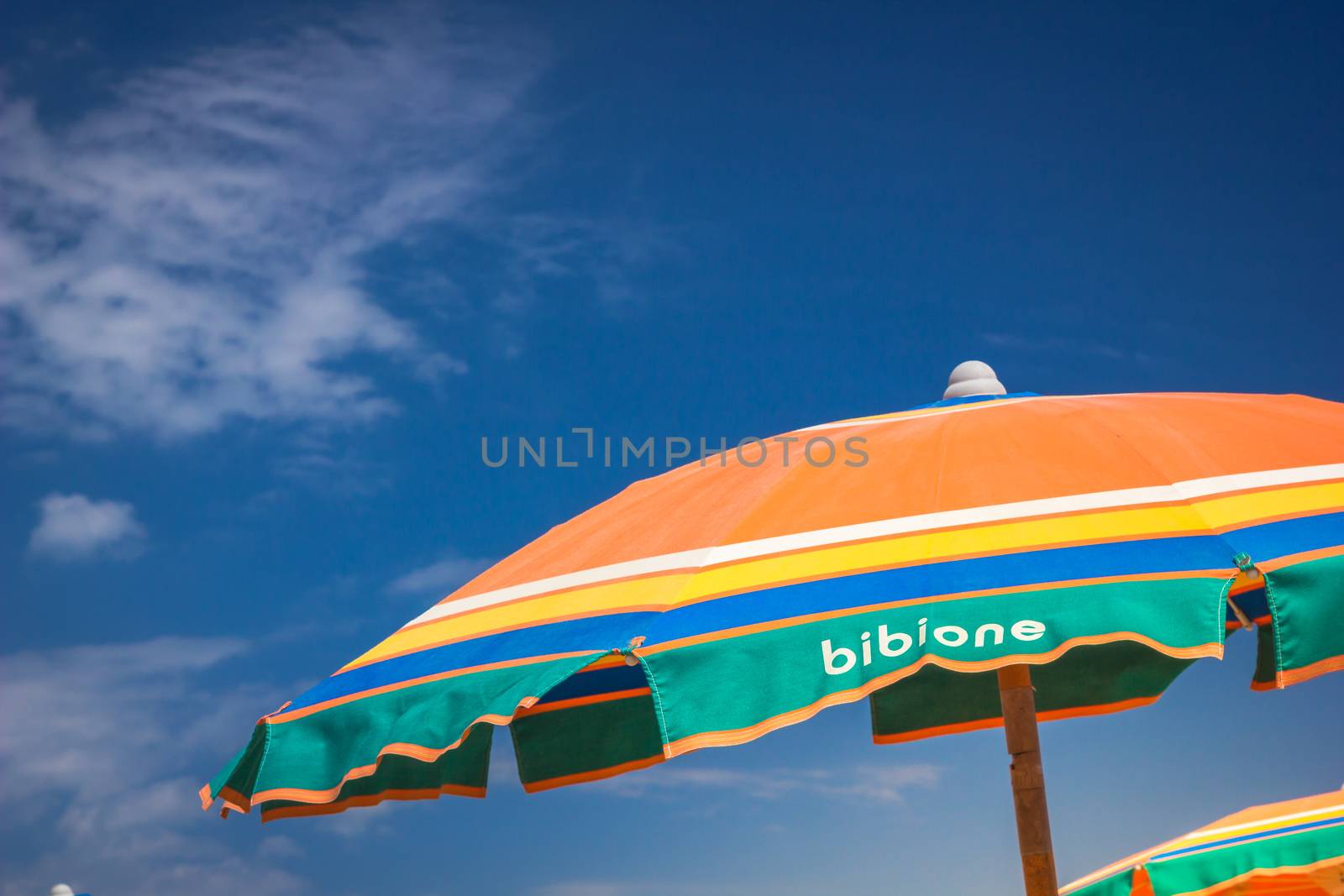 Umbrella beach for relaxing and sun set beach against blue sky. Bibione, Italy by petrsvoboda91