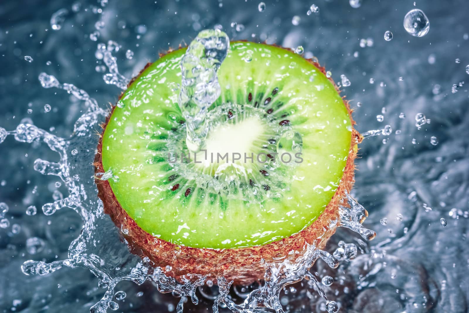 Kiwi fruit water splash - Concept of fresh tasty healthy fruit.