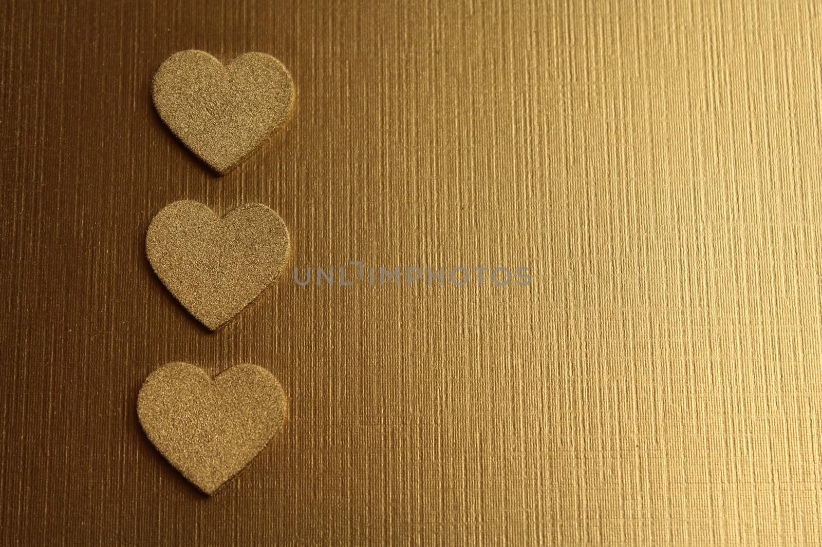 golden hearts on a golden background by martina_unbehauen