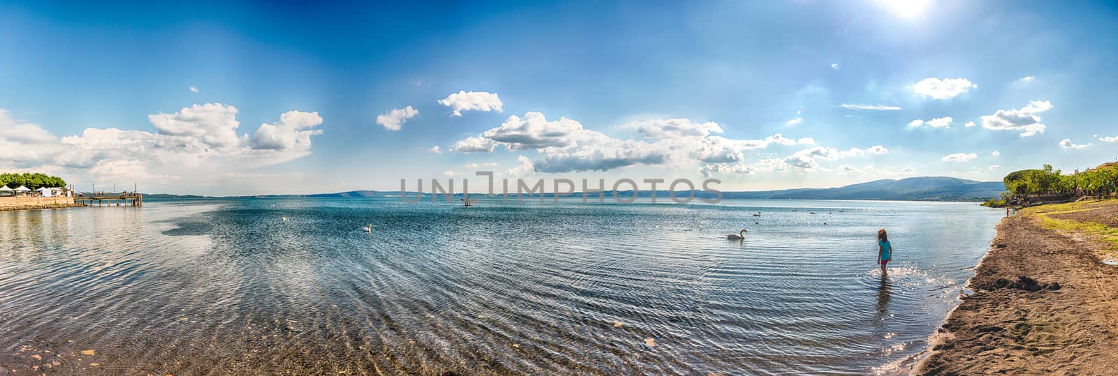 Panoramic view over lake Bracciano from the Trevignano side, with swans and a beautiful afternoon golden light