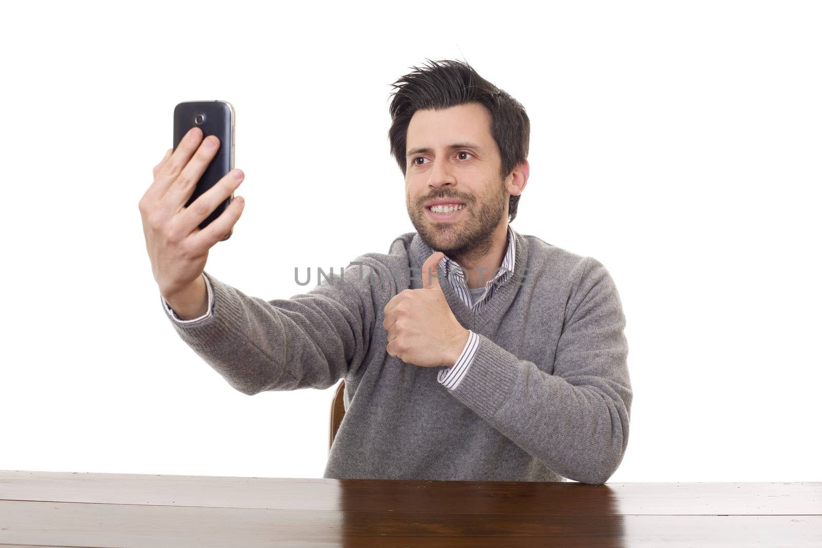 man taking selfie photo with mobile phone camera posing happy and successful isolated on white background