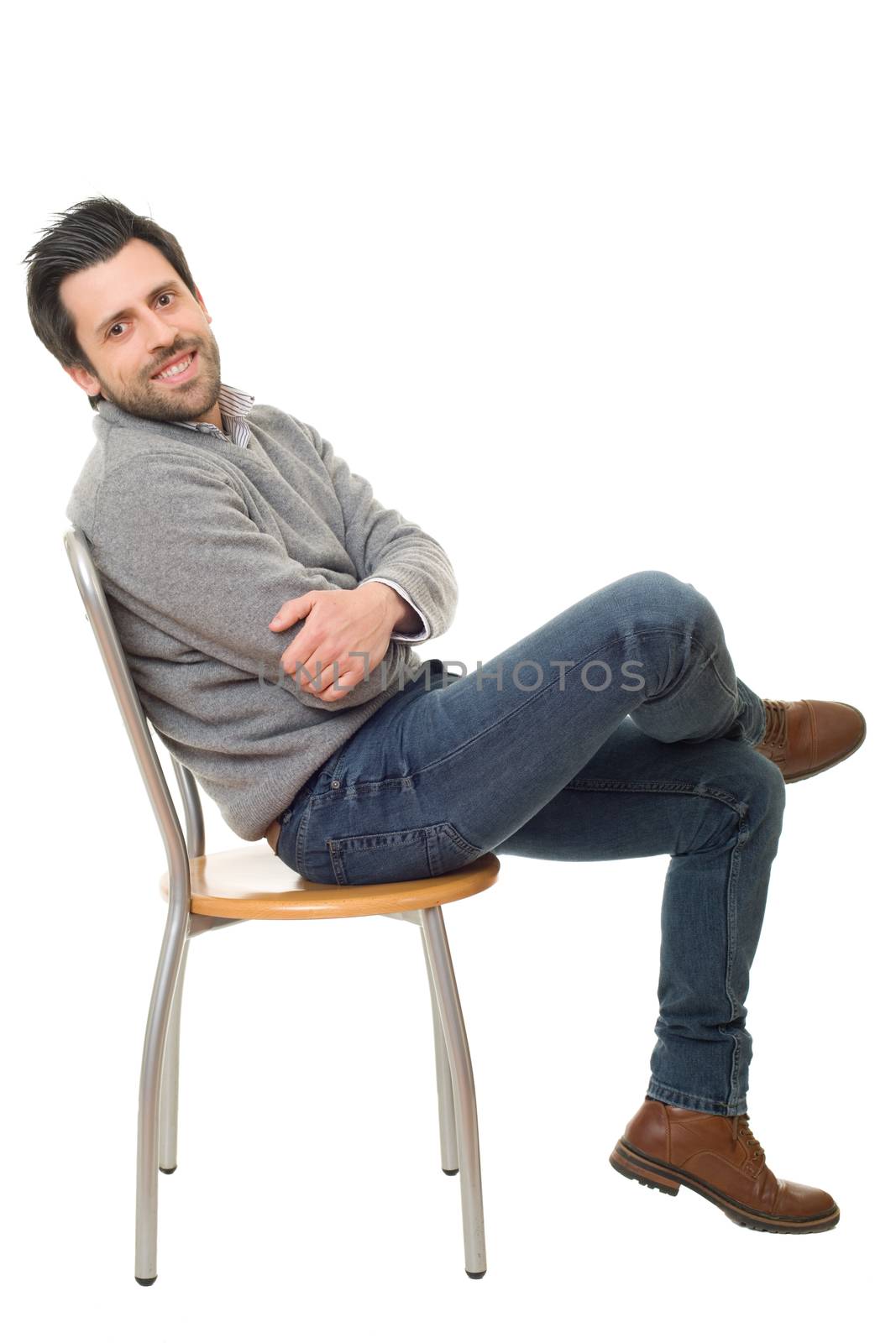 happy casual man on a chair, isolated on white background