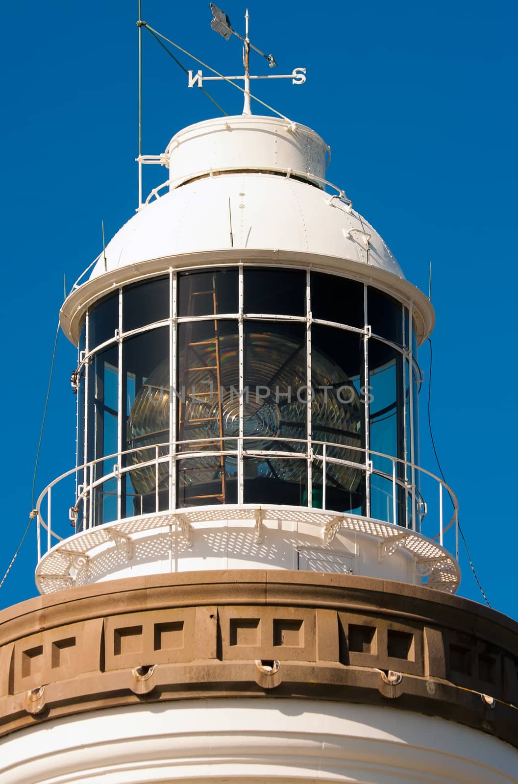 The lamphouse dome of a lighthouse showing fresnel reflector by definitearts