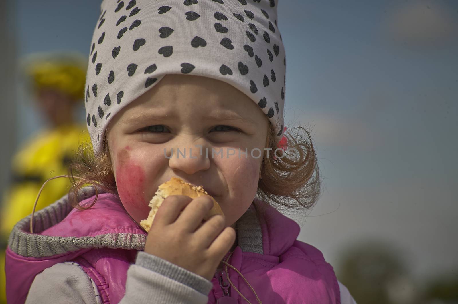 ROVIGO, ITALY 19 FEBRUARY 2020: Little girl in the foreground eats